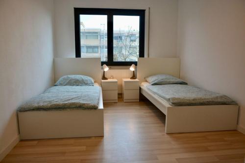 Lampertheim Apartamento | Großzügige Monteurwohnungen mit perfekter Verkehrsanbindung und Parkplatz