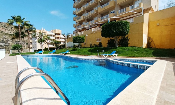 Cala Reona Apartamento | Apartamento bajo, vistas al mar, parking, piscina comunitaria