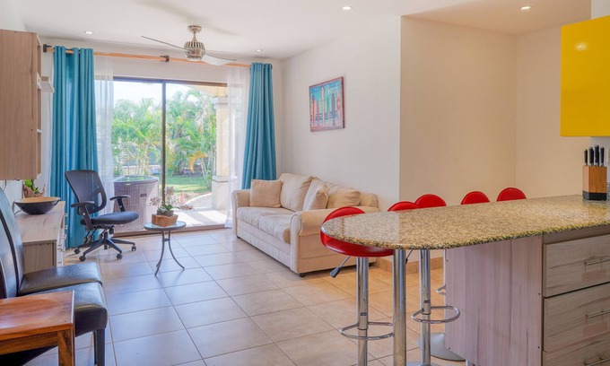Villarreal Condominio | Ground-floor condo with pool & garden views, terrace, hot tub, AC, & W/D
