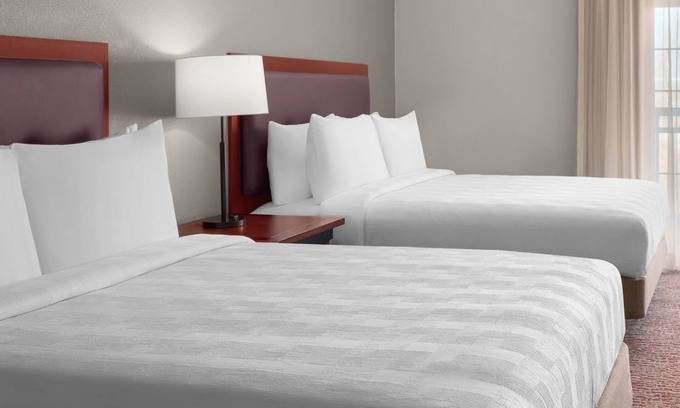 The East Side Hotel | Group Comfort – Homey Suite w/ Kitchen, Living Area & Free Airport Shuttle