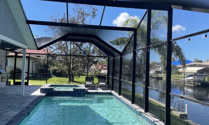 Pelican Casa | Gulf access pet friendly waterfront oasis with NEW heated salt water pool & spa