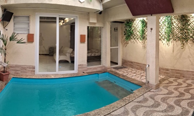 Zona Leste Casa | Heated pool and fireplace for couples