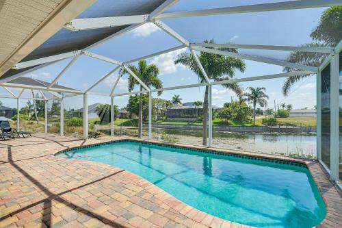 Trafalgar Casa | Heated Pool and Patio Canal-Front Cape Coral Home!
