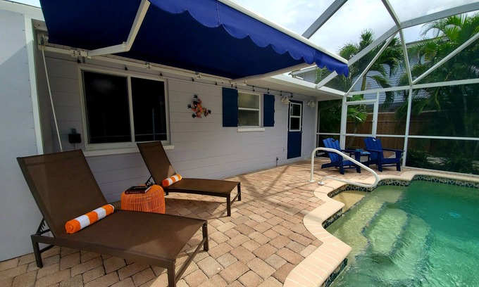 Englewood Casa | Heated Pool, Bikes, Kayaks, Sups, Outdoor Tiki Bar with TV! & Corn Hole Court
