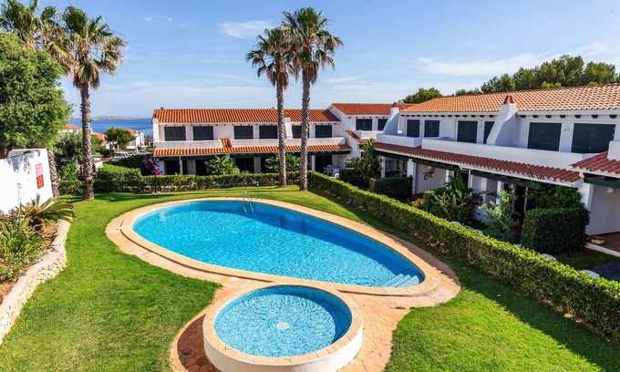 Arenal d'en Castell Casa | Casa "Maison Menorca" con vistas al mar, piscina compartida y Wi-Fi