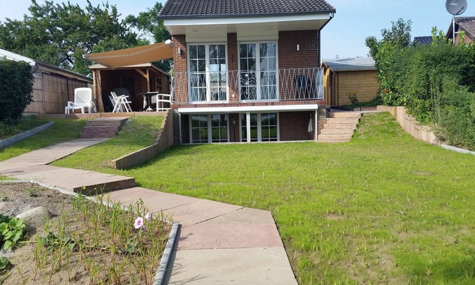 Travemuende Casa | Casa de vacaciones Priwall con vista al lago en un ambiente relajado "DOBLE FRENTE AL AGUA"