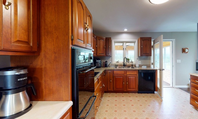 South Burlington Casa | Dog-friendly home with mountain view, large yard, fire pit, & 3-season room