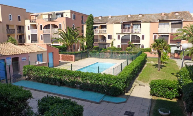 Les Arenes Apartamento | Homerez - Apartamento a 900 m de la playa para 4 pers. con piscina compartida
