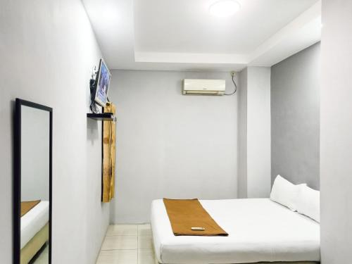 Waru Casa | Hotel Prisma Mitra RedDoorz