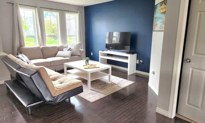 Southeast Edmonton Casa | House in Summerside with a huge patio and an extra tall garage