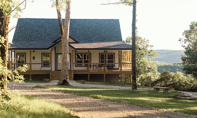 Kimberling City Casa | Huckleberry Hollow, secluded home in the woods, wraparound porch, soaker tub!