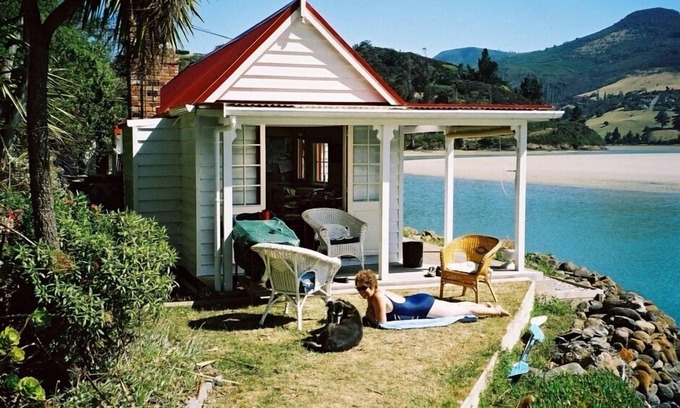 Purakaunui Casa | Icónica cabaña histórica junto al mar