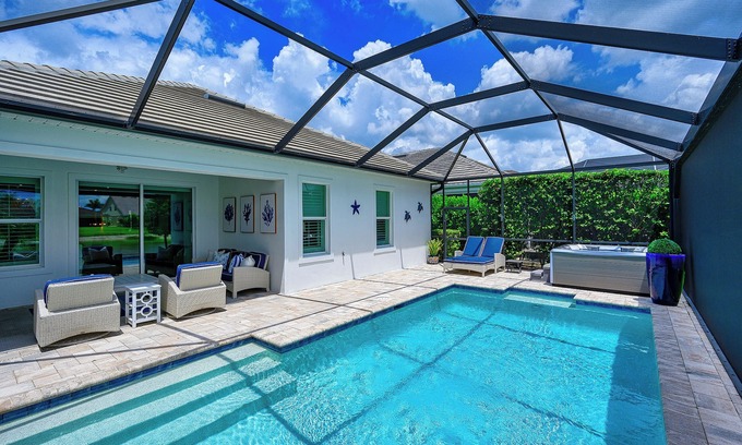 Rural Estates Casa | Indulge in a lavish home, heated saltwater pool, & spa, near all Naples offers.