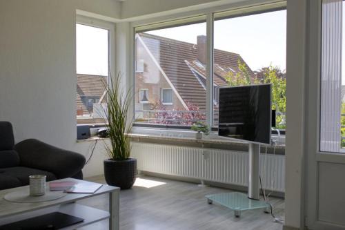 Neue Tiefe Casa | Inselblume 58 - Ferienwohnung mit Balkon in Neue Tiefe