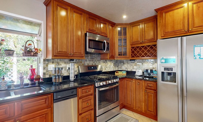 Fremont Casa | Inviting home with pool, fitness area, fireplace, & W/D