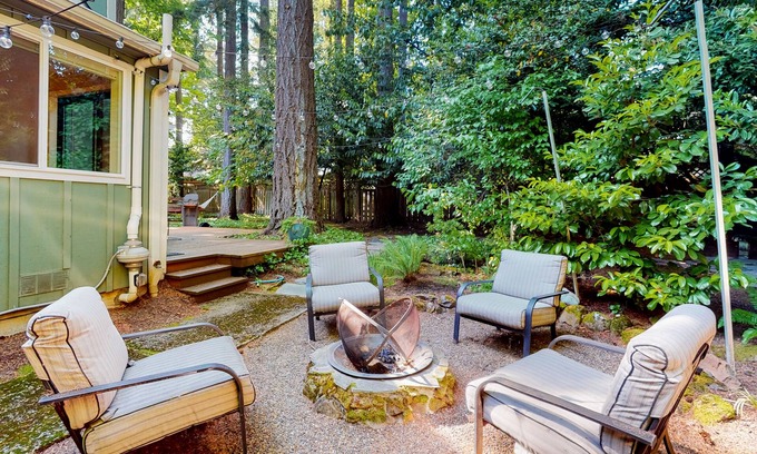 Lake Grove Casa | Inviting home with enclosed yard, firepit, hot tub, hammock, washer/dryer
