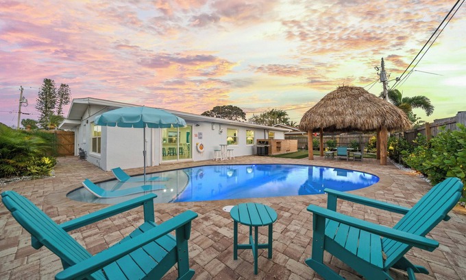Surfside Estates Casa | Island Oasis with Heated Pool, Putt Putt Course, Tiki Bar, and Beach Gear!