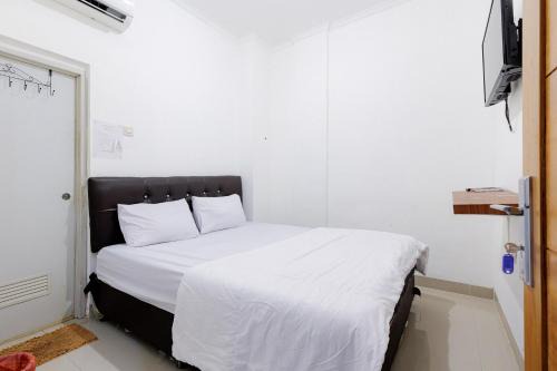 Jakarta Hotel | JJ House Mitra RedDoorz