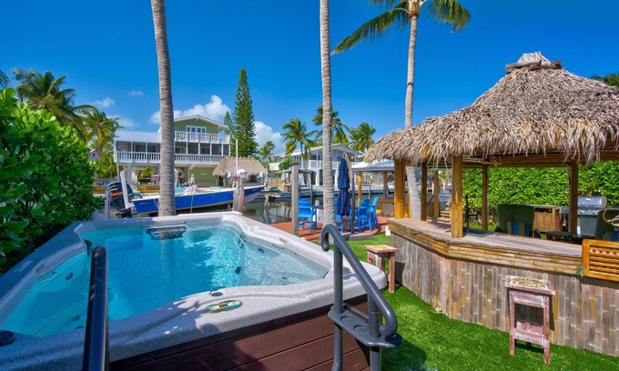 Twin Lakes Casa | Key Largo Canalfront Home w/ Boat Lift, Swim Spa, Tiki Hut & Game Room