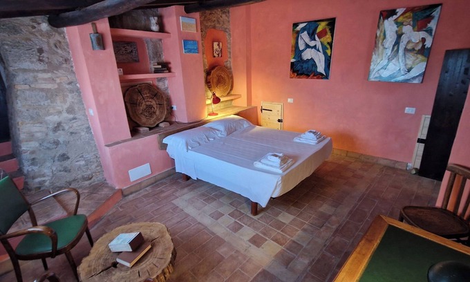 Allumiere Apartamento | La Quinta - Suite with living room and outdoor garden