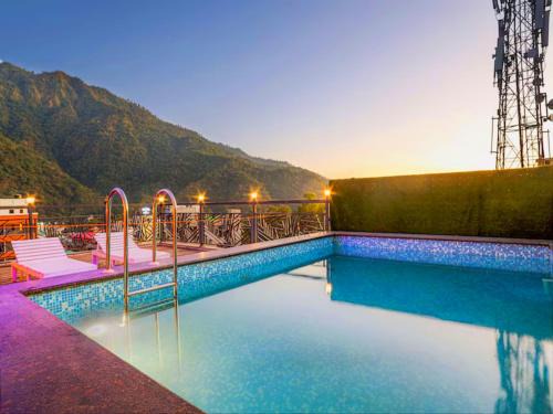 Tapovan Hotel | LA Riqueza Pride Inn # Customer's Favourite Hotel in Tapovan #Free use of Swimming Pool & Gym # Mountain View Rooms # Close to Lakshman Jhula # Free Parking