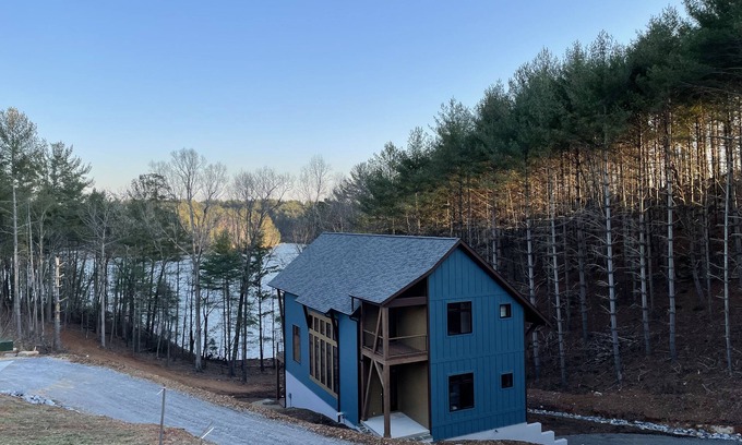 Nebo Casa | Lake front home with dock in a small cove with a beach.