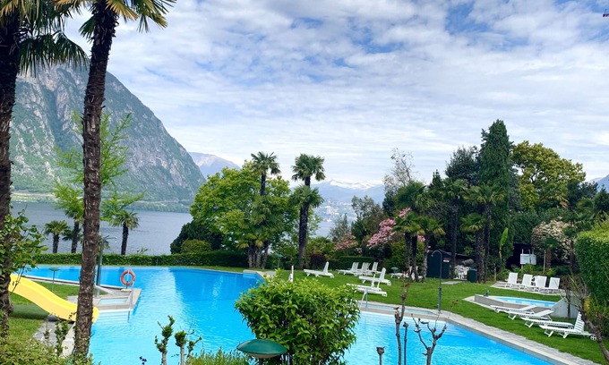 Bissone Apartamento | Lake view apartment with terrace, outdoor pool and parking space
