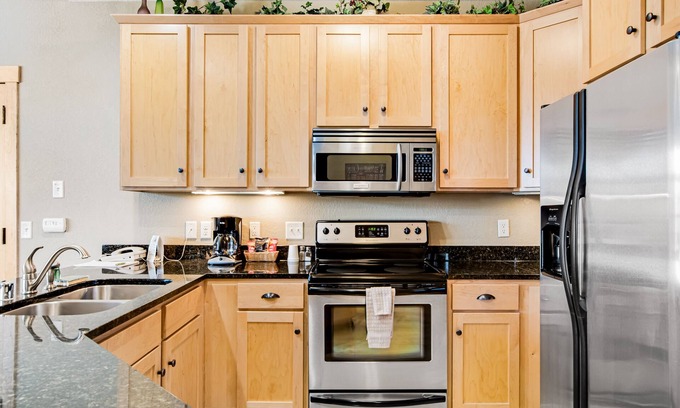 Three Lakes Condominio | Lake-view condo with pool and hot tub access, jetted tub, firepit, and a balcony