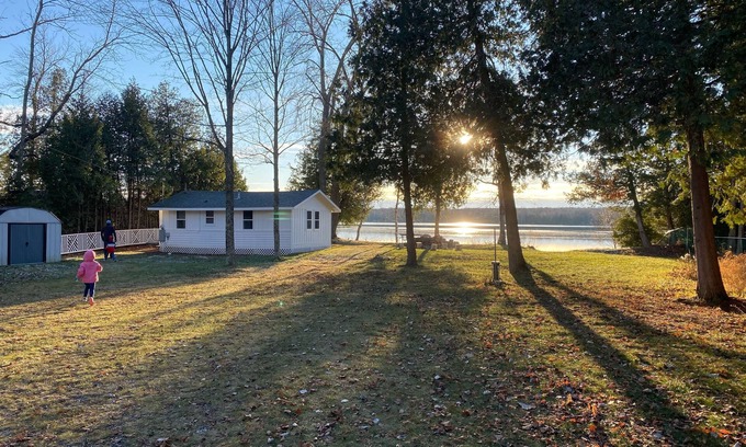 Baileys Harbor Cabaña | Lakefront Cottage Retreat w/ Private Dock, Paddle Boards, Fire Pit, Sunset Views