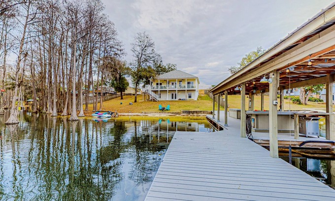 Marianna Casa | Lakefront home with amazing sunset/water view, private dock, & firepit