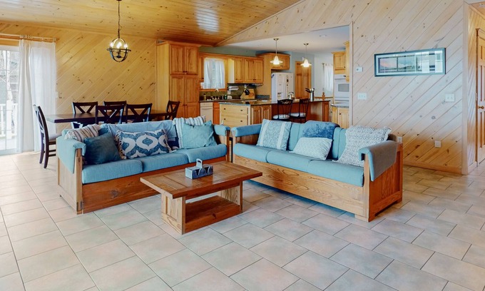 Otis Casa | Lakefront home with dock, kayak, firepit, screened porch, fireplace, & W/D