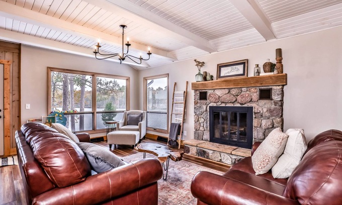 Sayner Casa | Lakefront home with private dock, deck, fireplace, firepit, canoe & paddleboat