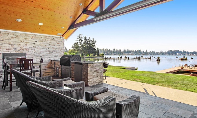 Bonney Lake Casa | Lakefront house with built-in bar & grill, fireplace, beach, & dock