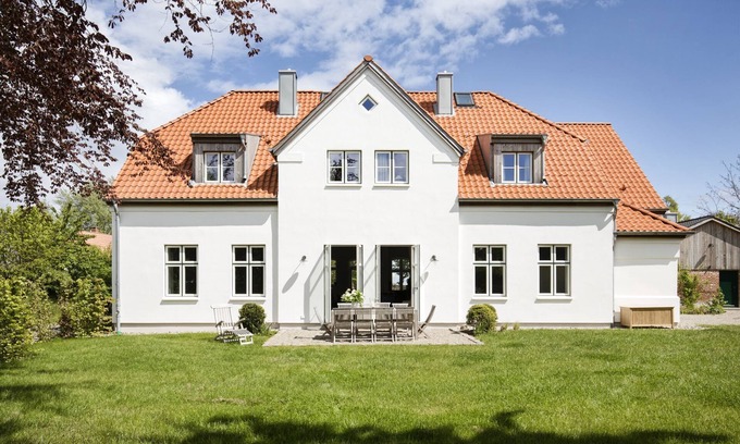 Pommerby Casa | Large vacation home with a view of the Baltic Sea, fireplace and sauna