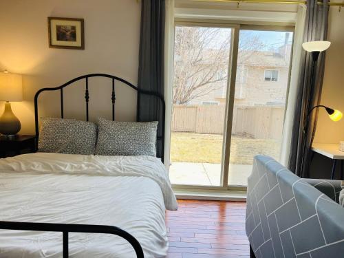 Southwest Calgary Casa | Lily room near golf and banff costco newly renovated queen size bed Single bathroom sofa TV