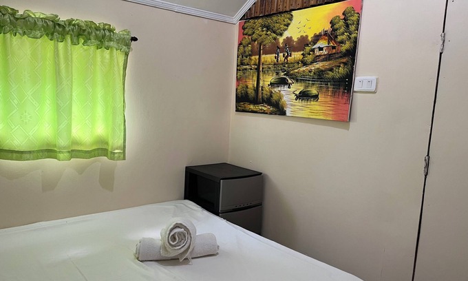 Bacnotan Cabaña | Local style cottage in a garden setting - cosy comfort with A/C
