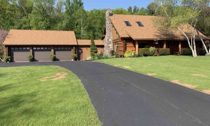 Sheboygan Falls Casa | Log Cabin Style Home on 28 acres of land