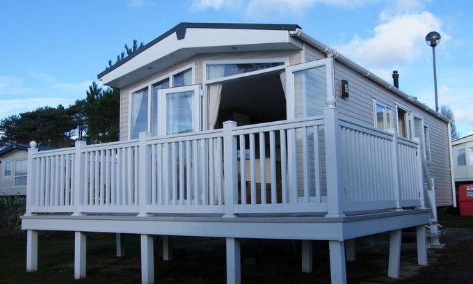 Hamworthy Casa | Lotus 2 bedroom dog friendly caravan with veranda offers a stunning sea view.