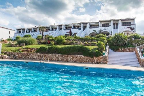 Arenal d'en Castell Apartamento | Lovely hideaway with pool and white sand beach