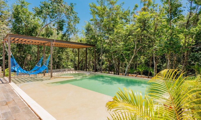 Xpu-Ha Apartamento | Lower level apartment with high-speed internet pool, gym, & tennis courts