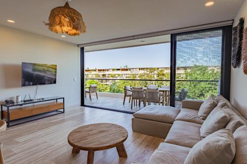 Playacar Apartamento | Lush Escape at Awa Playacar