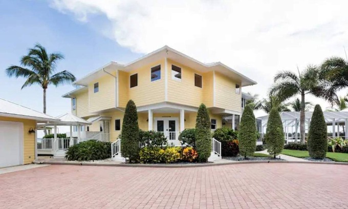 Palm City Casa | Lush Waterfront Pool Home and Pool house with Pickleball court and Boat dock