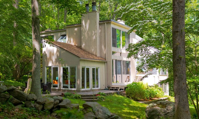 Old Lyme Casa | Luxurious midcentury modern glass house in the woods, chefs kitchen & great art