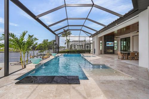 Pelican Casa | Luxury and Opulence - Gulf Access, Heated Pool & Spa, Custom Outdoor Kitchen - Villa Sunseeker