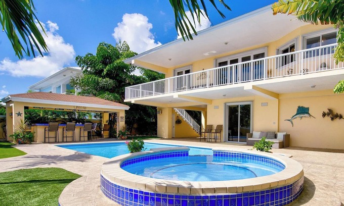Twin Lakes Casa | Luxury Water Front Home, Private Pool, Spa, Tiki Bar, 37' Foot Dock with Kayaks