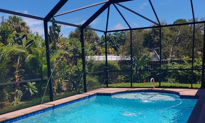 Tropic Apartamento | Master bedroom suite with pool. Eight minutes to beaches.
