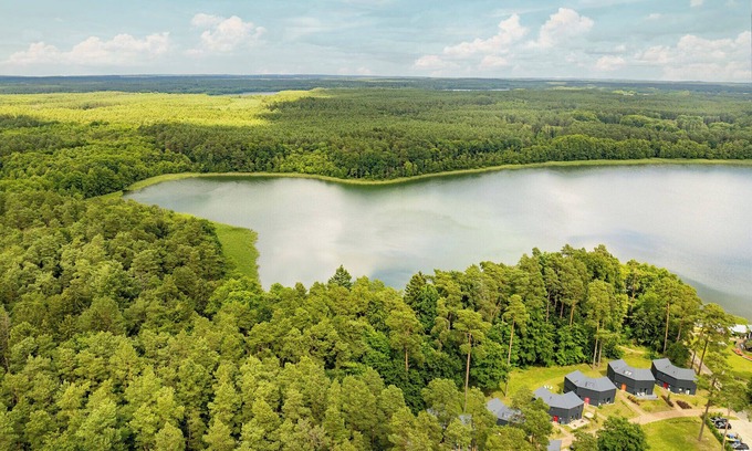 Postheim Casa | Modern house for 8 people with fireplace, roof terrace and sauna on Lake Lübbe.