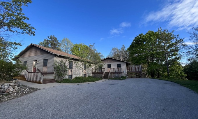 Charlevoix Casa | Modern, Huge, Hot Tub, Game Room! <1 mile from Lk Michigan, ADA & kid friendly!