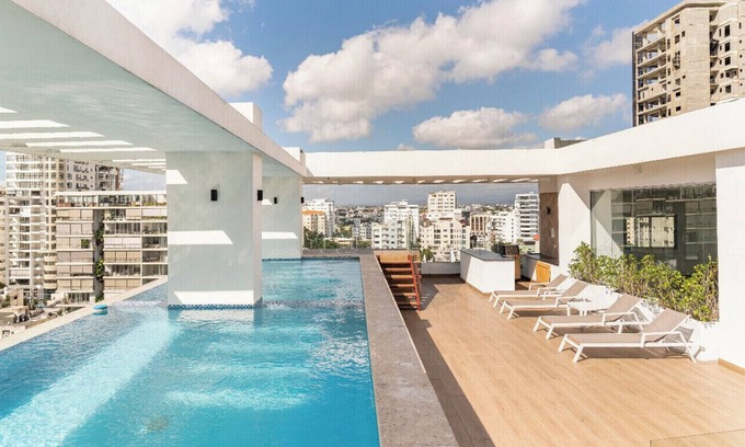 Viejo Arroyo Hondo Condominio | Modern King Size Bed Condo with Pool by Agora Mall