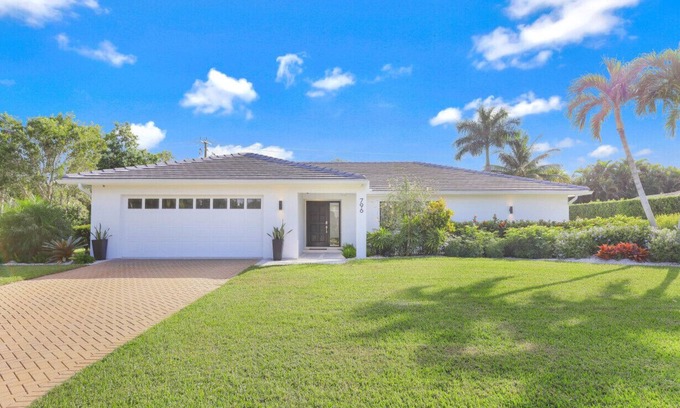 Moorings Casa | Modern Oasis: Private Beach Access. Minutes from Downtown & Optional Golf Cart